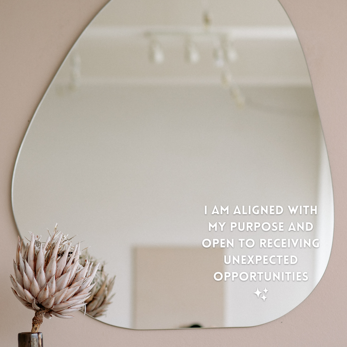 Mirror transfer sticker that says "I am aligned with my purpose and open to receiving unexpected opportunities" 