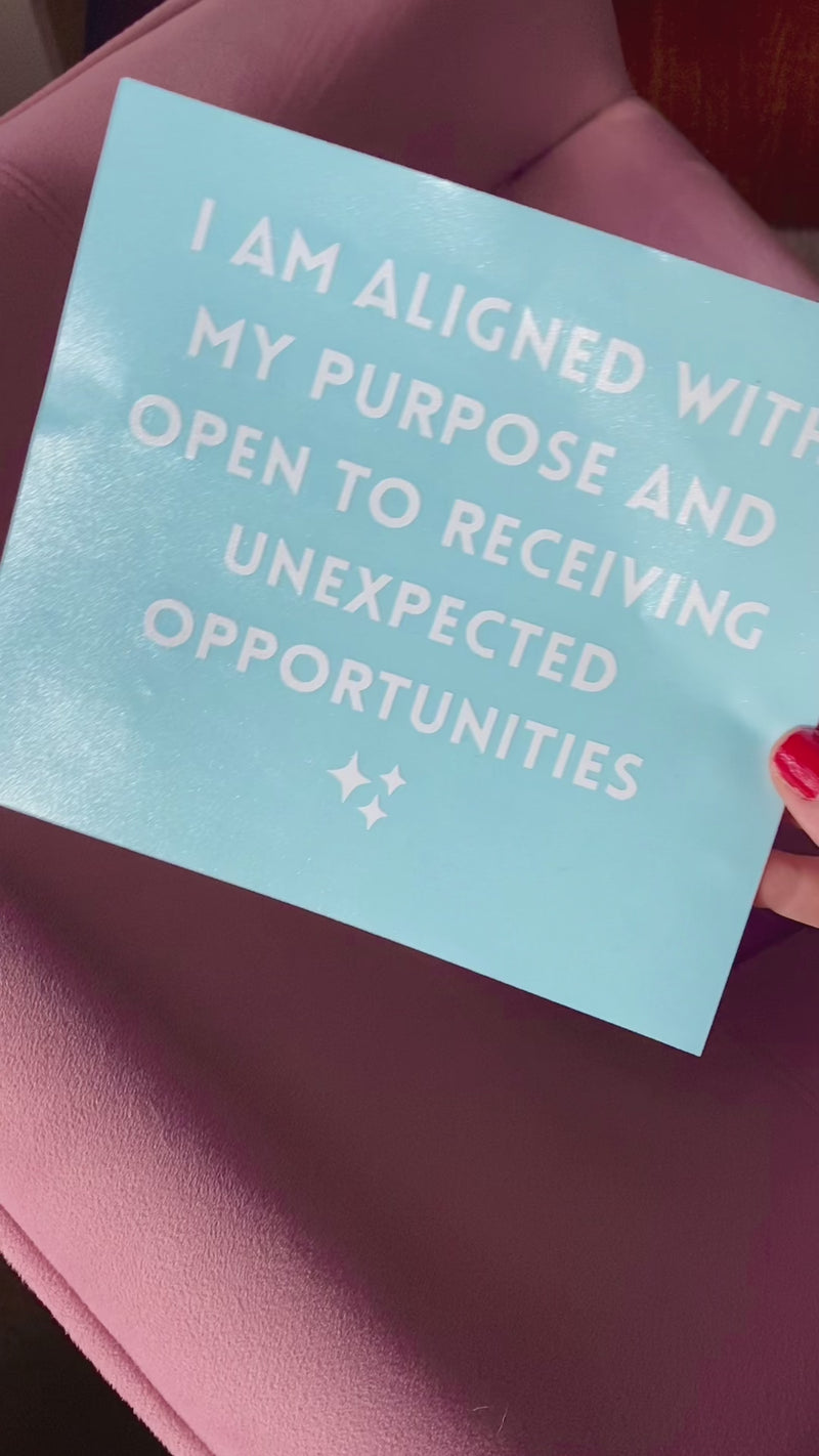 Mirror transfer sticker that says "I am aligned with my purpose and open to receiving unexpected opportunities" 